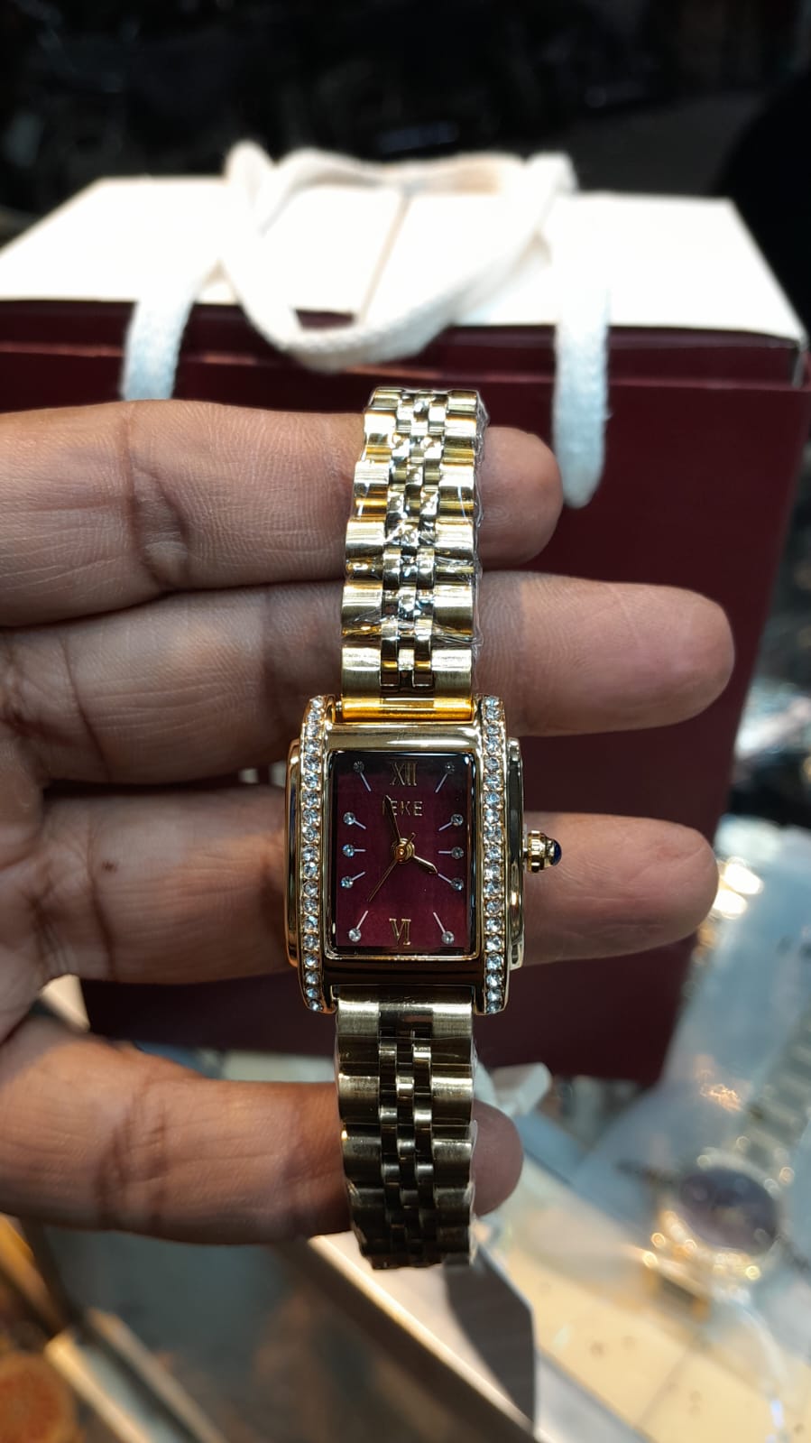 Elegant Women's Gold-Plated Rectangular Watch with Deep Burgundy Dial and Crystal Bezel